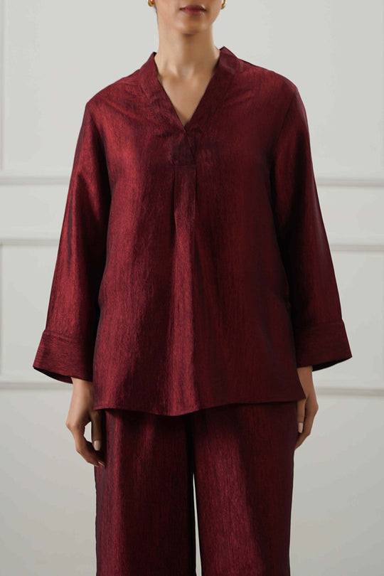 RUST TEXTURED FLOWY V NECK TOP