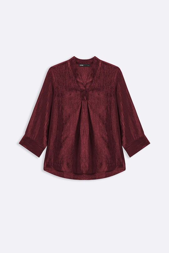 RUST TEXTURED FLOWY V NECK TOP