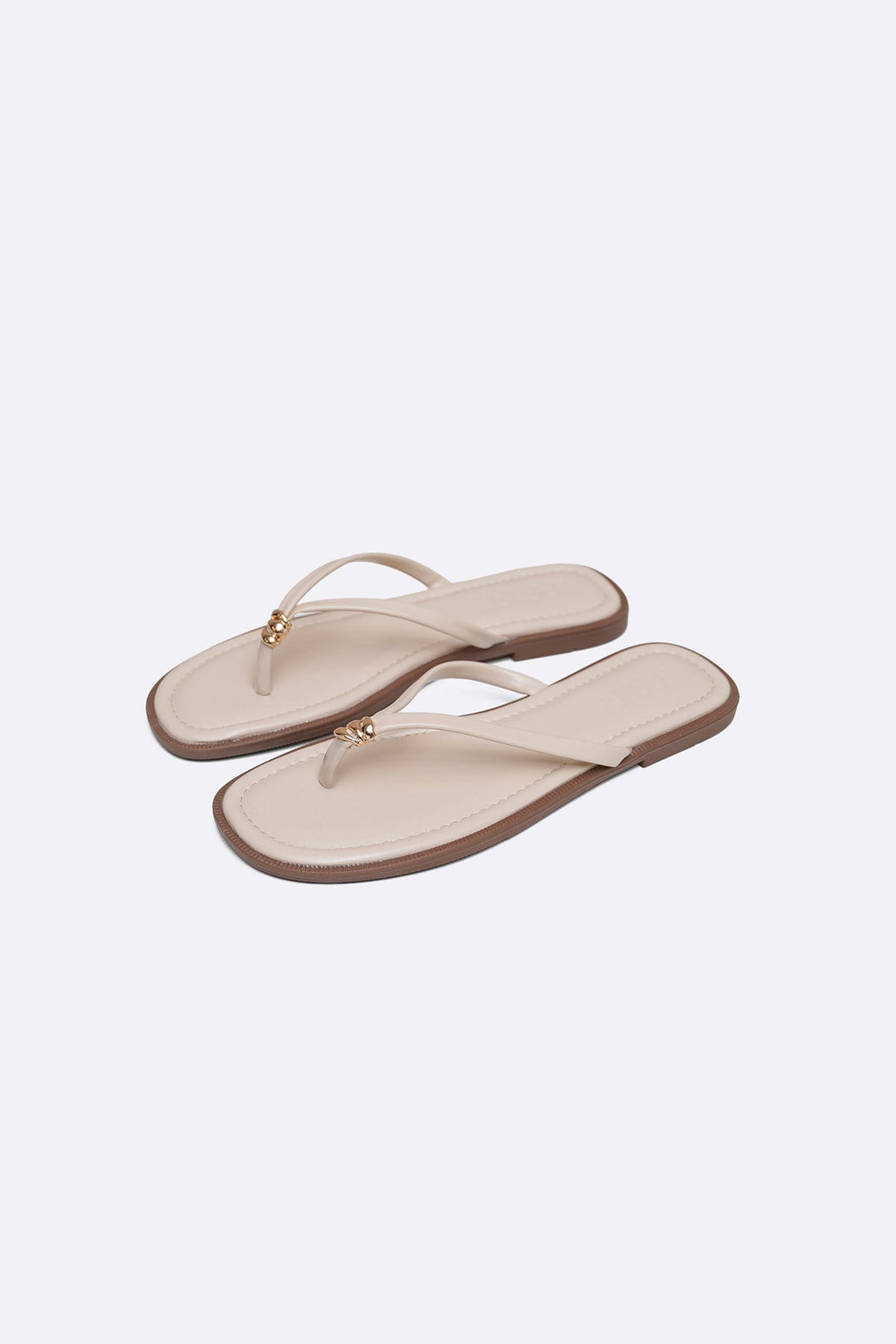BEIGE STUD STUFF FLIP FLOPS