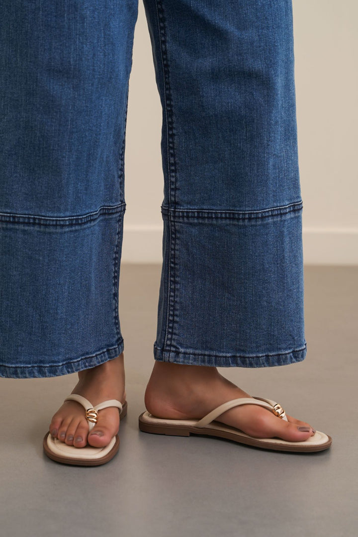 BEIGE STUD STUFF FLIP FLOPS