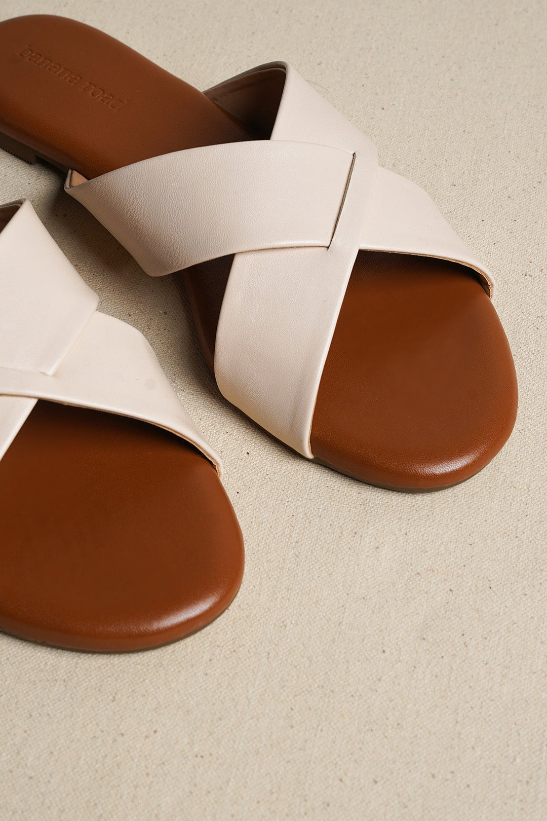 OFF WHITE CROSS STRAP SLIDES